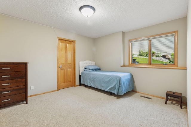 11871 Flanders Cir NE, Blaine, MN 55449 - carpeted bedroom with a textured ceiling and baseboards