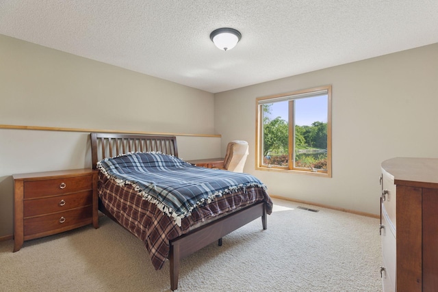 11871 Flanders Cir NE, Blaine, MN 55449 - bedroom featuring light colored carpet and a textured ceiling