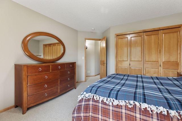 11871 Flanders Cir NE, Blaine, MN 55449 - bedroom featuring light carpet, a textured ceiling, and a closet