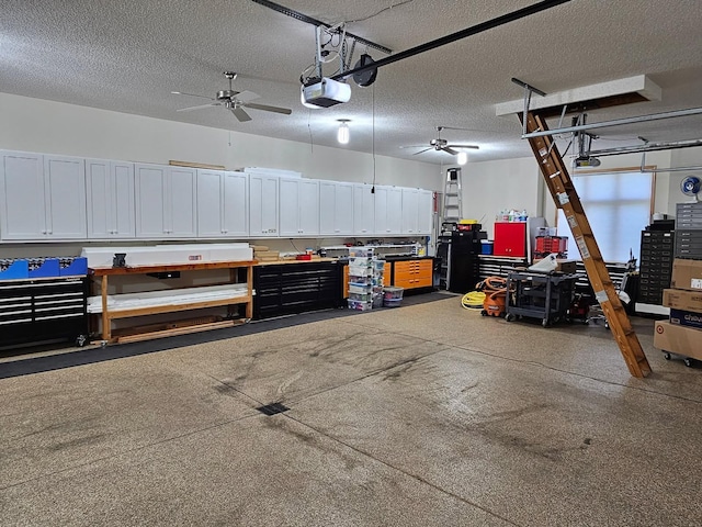 11871 Flanders Cir NE, Blaine, MN 55449 - garage with a garage door opener, a workshop area, and a ceiling fan