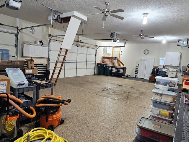11871 Flanders Cir NE, Blaine, MN 55449 - garage with a garage door opener and a ceiling fan