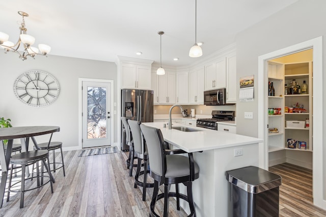 3344 26th Ave S, Saint Cloud, MN 56301 - kitchen with a sink, appliances with stainless steel finishes, light wood finished floors, light countertops, and recessed lighting