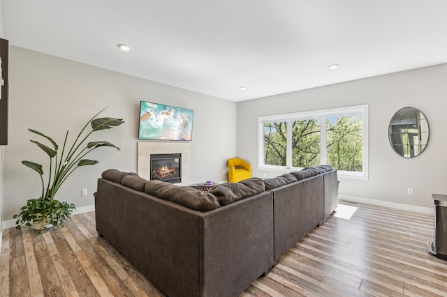 3344 26th Ave S, Saint Cloud, MN 56301 - living room with light wood-type flooring, baseboards, a fireplace, and recessed lighting