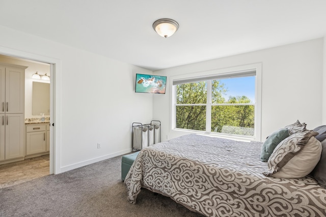 3344 26th Ave S, Saint Cloud, MN 56301 - carpeted bedroom with ensuite bathroom and baseboards
