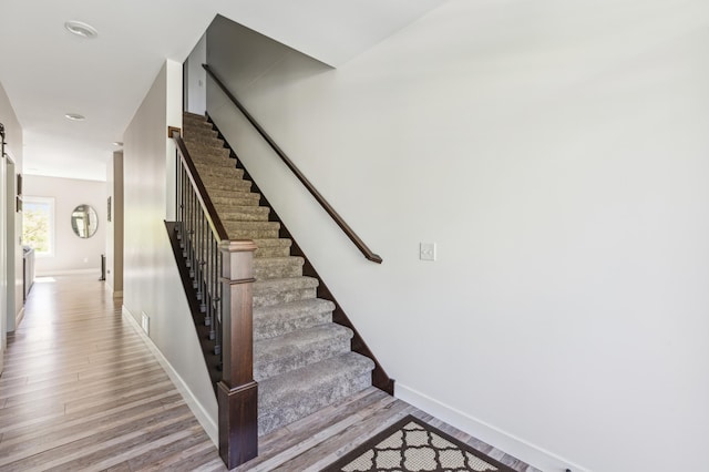 3344 26th Ave S, Saint Cloud, MN 56301 - stairway featuring wood finished floors and baseboards