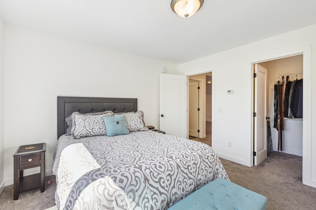 3344 26th Ave S, Saint Cloud, MN 56301 - bedroom with carpet flooring, a walk in closet, baseboards, and a closet