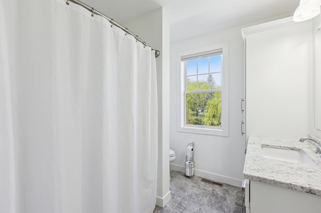 3344 26th Ave S, Saint Cloud, MN 56301 - full bathroom with baseboards, toilet, and vanity
