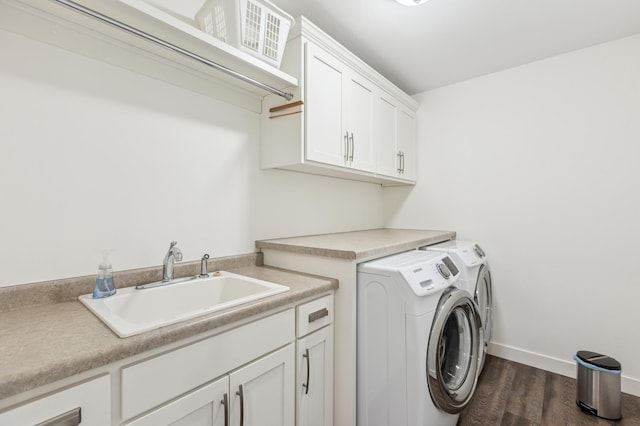 3344 26th Ave S, Saint Cloud, MN 56301 - clothes washing area with washer and clothes dryer, cabinet space, dark wood finished floors, and baseboards