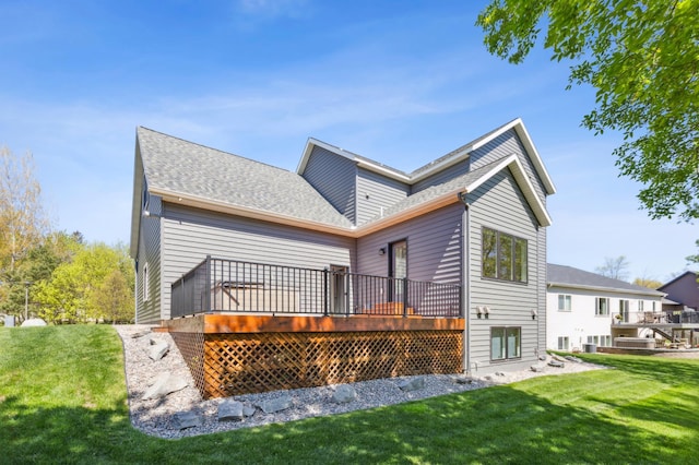 3344 26th Ave S, Saint Cloud, MN 56301 - back of property featuring a lawn, a deck, and roof with shingles