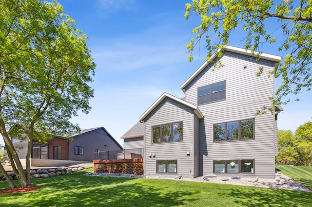 3344 26th Ave S, Saint Cloud, MN 56301 - back of property with a lawn and a deck