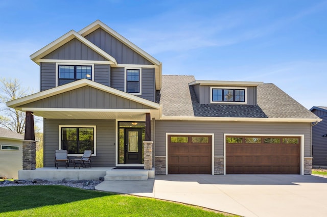 3344 26th Ave S, Saint Cloud, MN 56301 - craftsman house featuring a porch, board and batten siding, driveway, a garage, and roof with shingles