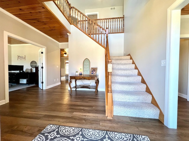 2543 Sunny Meadow Ln, Red Wing, MN 55066 - stairway featuring wood finished floors, baseboards, crown molding, and wooden ceiling