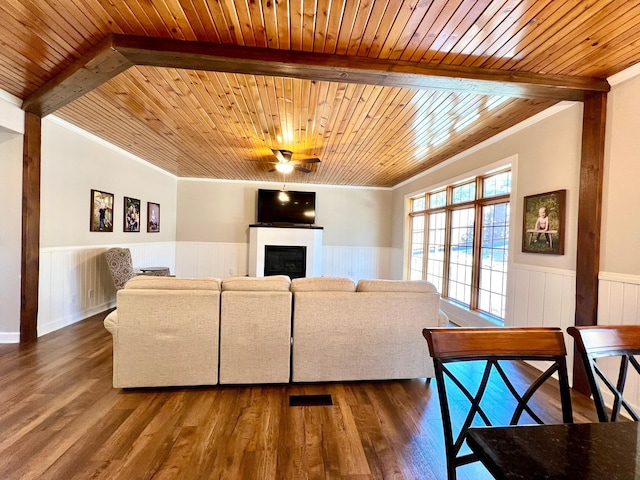 2543 Sunny Meadow Ln, Red Wing, MN 55066 - living area with wood ceiling with exposed beams, crown molding, a wainscoted wall, a ceiling fan, and dark wood-style floors