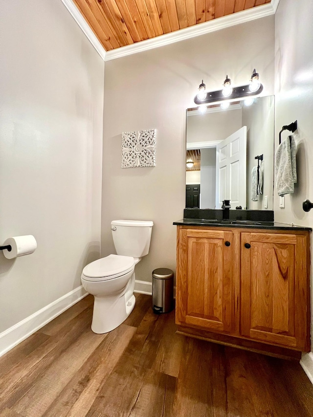 2543 Sunny Meadow Ln, Red Wing, MN 55066 - half bath featuring crown molding, toilet, wood finished floors, vanity, and baseboards