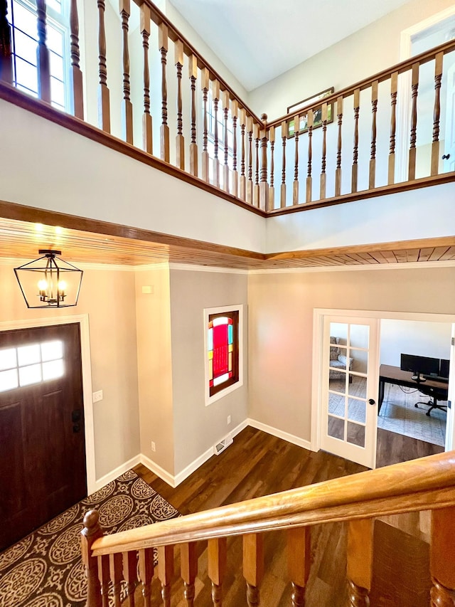 2543 Sunny Meadow Ln, Red Wing, MN 55066 - entryway featuring a towering ceiling, wood finished floors, a chandelier, plenty of natural light, and baseboards