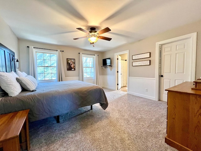 2543 Sunny Meadow Ln, Red Wing, MN 55066 - bedroom with wainscoting, light carpet, and ceiling fan