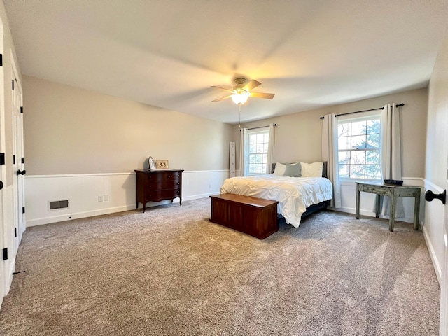 2543 Sunny Meadow Ln, Red Wing, MN 55066 - carpeted bedroom with wainscoting and ceiling fan