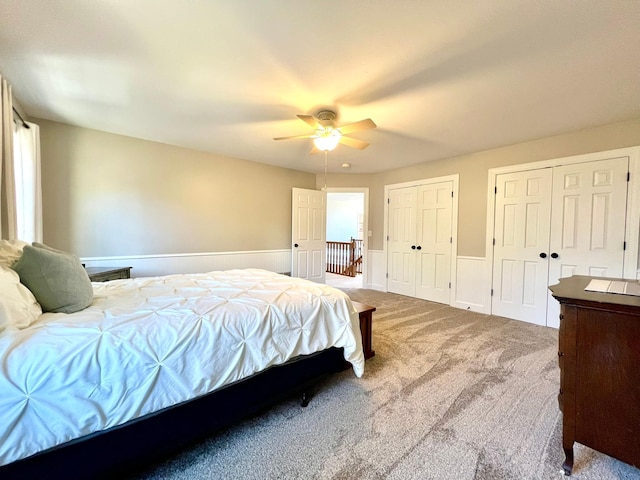 2543 Sunny Meadow Ln, Red Wing, MN 55066 - bedroom with wainscoting, carpet floors, multiple closets, and a ceiling fan