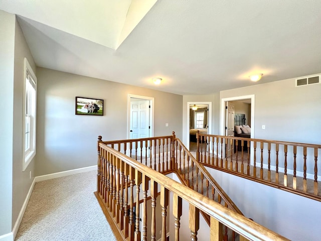 2543 Sunny Meadow Ln, Red Wing, MN 55066 - corridor with an upstairs landing, baseboards, and carpet floors