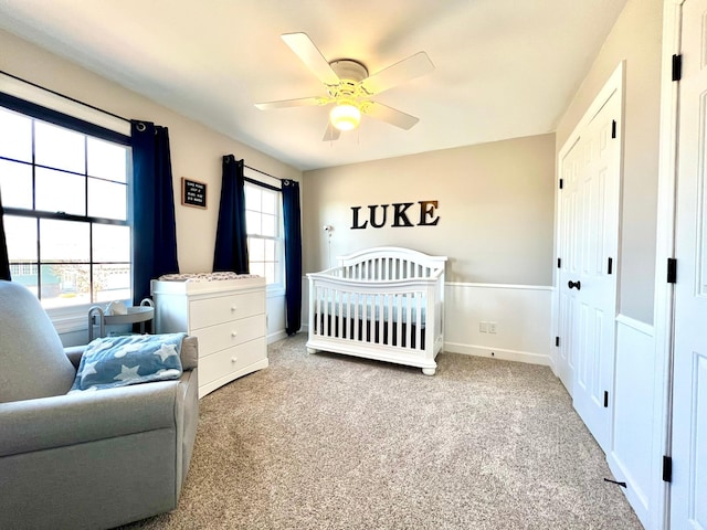 2543 Sunny Meadow Ln, Red Wing, MN 55066 - carpeted bedroom featuring a nursery area, a ceiling fan, and baseboards