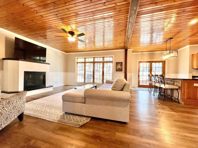 2543 Sunny Meadow Ln, Red Wing, MN 55066 - living room featuring ornamental molding, wood ceiling, wainscoting, ceiling fan, and wood finished floors