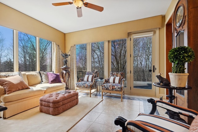 living room featuring a ceiling fan and tile patterned flooring