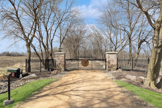 view of gate featuring fence