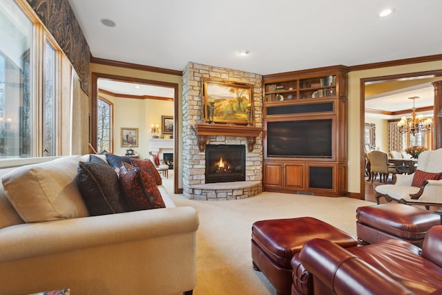 carpeted living area featuring a chandelier, a stone fireplace, recessed lighting, visible vents, and ornamental molding
