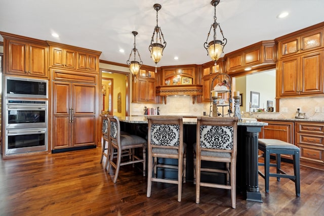 kitchen featuring brown cabinets, recessed lighting, glass insert cabinets, and built in microwave