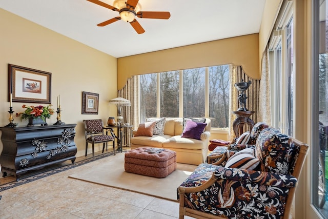 living room featuring tile patterned floors and ceiling fan