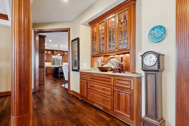 hall featuring recessed lighting, baseboards, and dark wood-style flooring