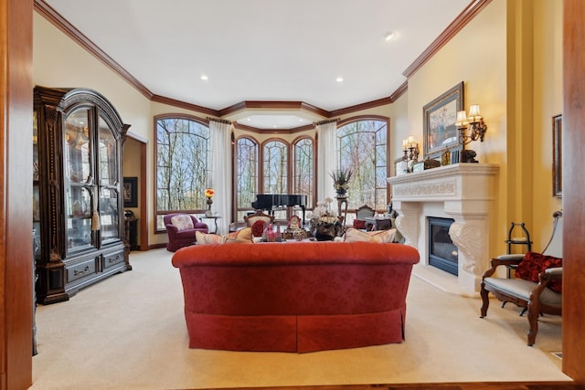 living area with a glass covered fireplace, crown molding, carpet, and recessed lighting