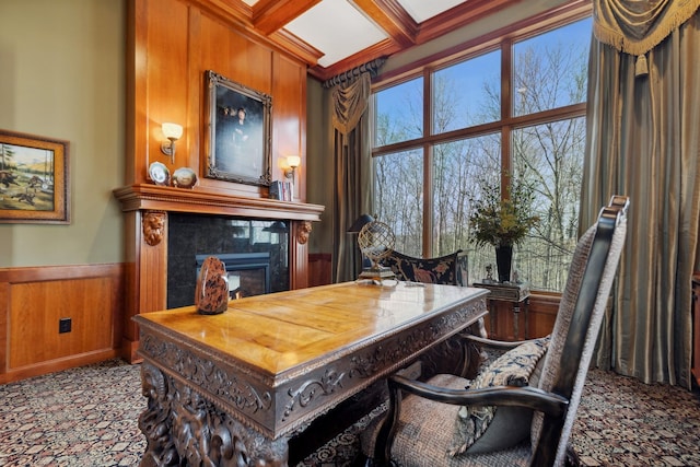 office with wood walls, beam ceiling, a fireplace, a wainscoted wall, and coffered ceiling