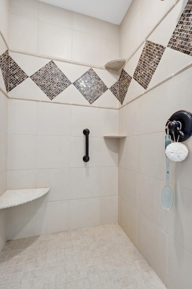 bathroom with a tile shower