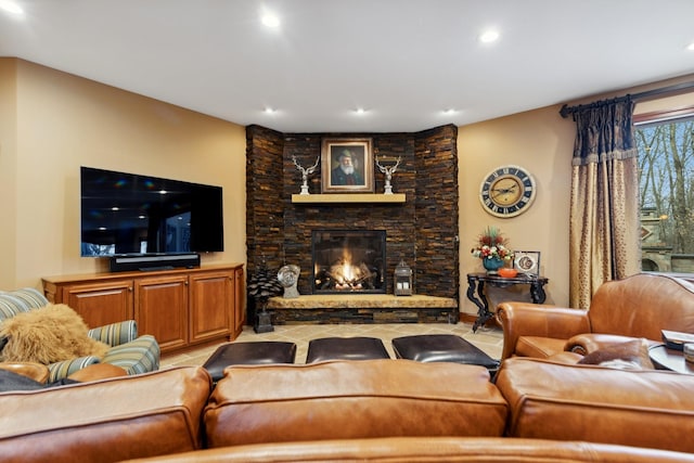 living area featuring a fireplace and recessed lighting