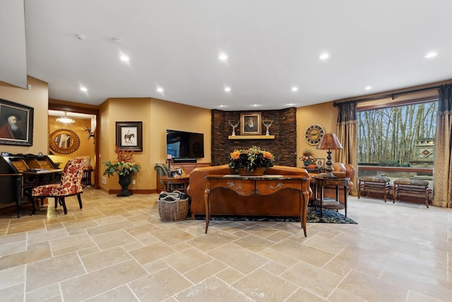 living area with recessed lighting, baseboards, and stone finish flooring