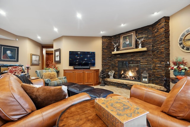 tiled living area with recessed lighting and a fireplace