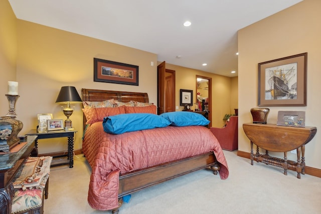bedroom featuring light colored carpet, recessed lighting, and baseboards