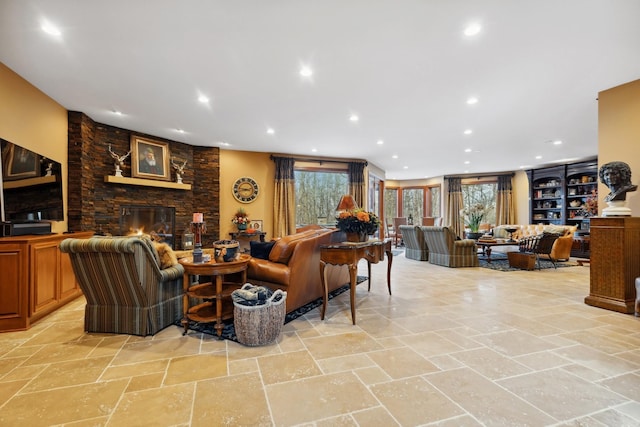 17620 Xanadu Ave, Jordan, MN 55352 - living room featuring a stone fireplace, plenty of natural light, and recessed lighting