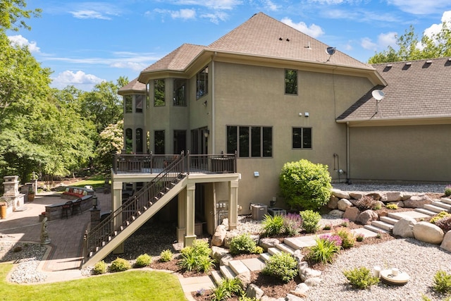 17620 Xanadu Ave, Jordan, MN 55352 - back of house featuring stairway, stucco siding, and a wooden deck