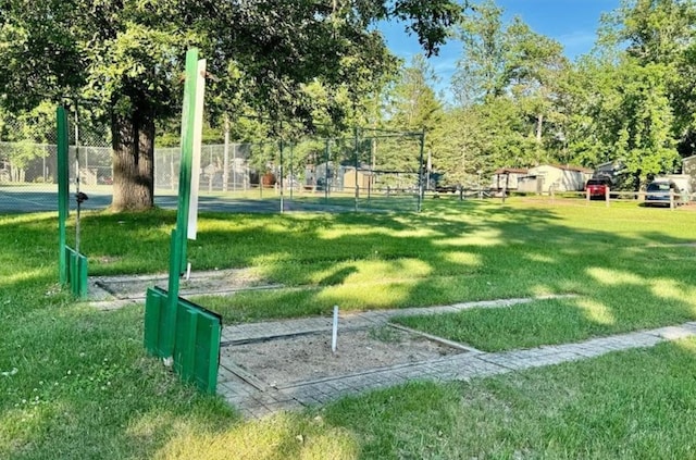 surrounding community featuring a yard and fence