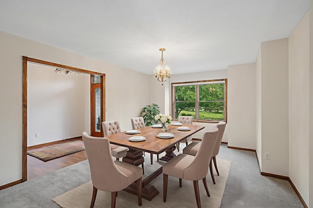 1159 Orwell Ave N, West Lakeland Twp, MN 55082 - dining space with a chandelier, baseboards, and light carpet