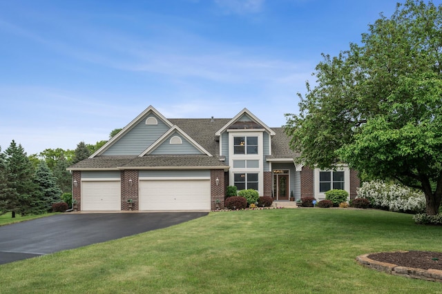 1159 Orwell Ave N, West Lakeland Twp, MN 55082 - traditional home with brick siding, driveway, an attached garage, a front lawn, and roof with shingles