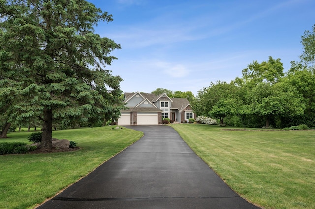 1159 Orwell Ave N, West Lakeland Twp, MN 55082 - view of front of house with a front lawn, driveway, and an attached garage