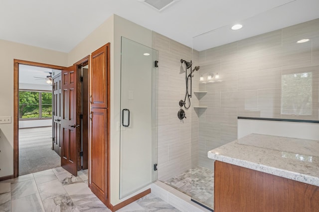 1159 Orwell Ave N, West Lakeland Twp, MN 55082 - full bath with a shower stall, marble finish floors, ceiling fan, baseboards, and vanity