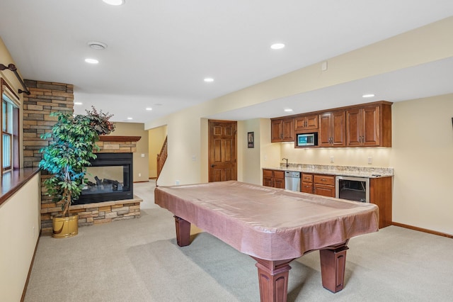 1159 Orwell Ave N, West Lakeland Twp, MN 55082 - rec room featuring light colored carpet, wet bar, wine cooler, a fireplace, and recessed lighting