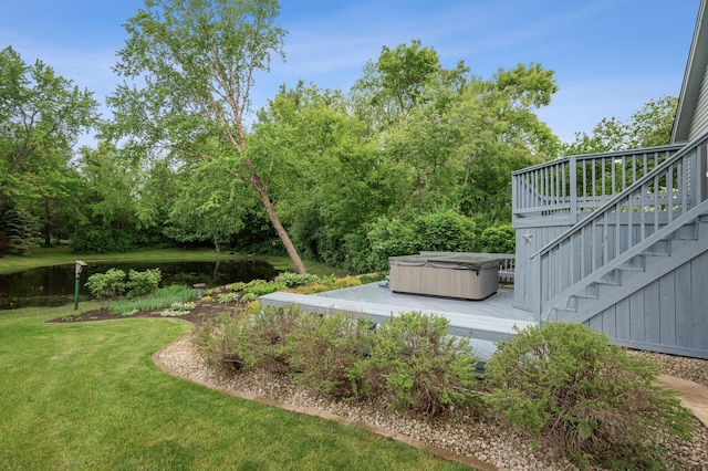1159 Orwell Ave N, West Lakeland Twp, MN 55082 - view of green lawn with a hot tub, a deck with water view, and stairway