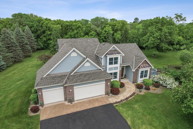 1159 Orwell Ave N, West Lakeland Twp, MN 55082 - traditional home with driveway, an attached garage, brick siding, and a front yard
