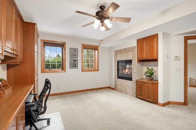 6507 Orchard Ridge Trl, Woodbury, MN 55129 - unfurnished office featuring light colored carpet, a fireplace, and a ceiling fan