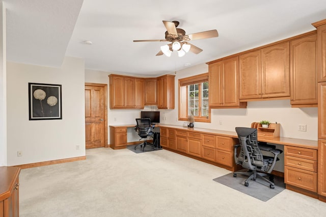 6507 Orchard Ridge Trl, Woodbury, MN 55129 - office featuring built in desk, a ceiling fan, and light carpet